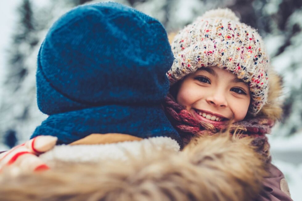 Girl smiling in winter clothes